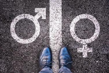 Genderteken op asfalt